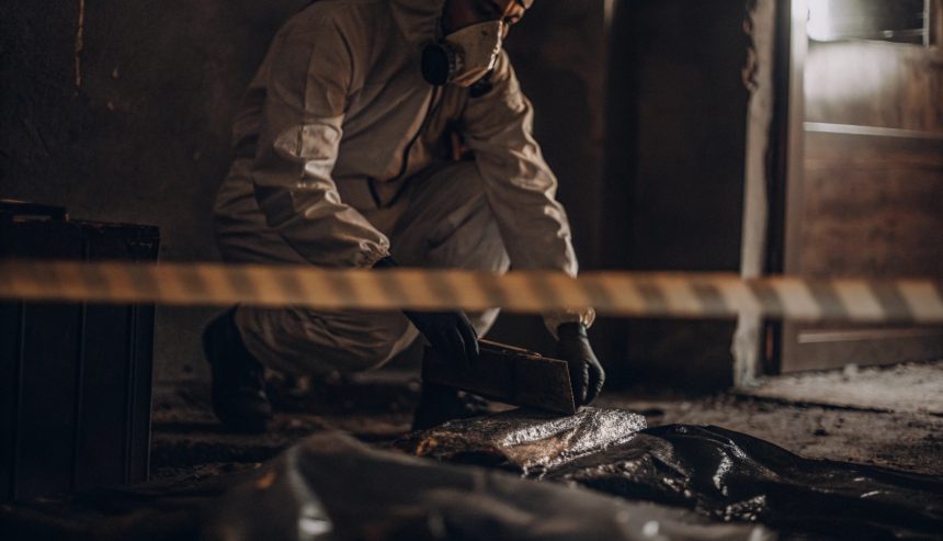 Professional performing biohazard cleanup in a rental property, illustrating landlord cleanup responsibilities under Alexandria biohazard cleanup laws..