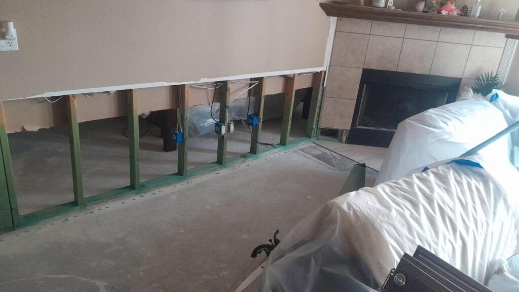 The cabinetry was removed to access the water damaged drywall.