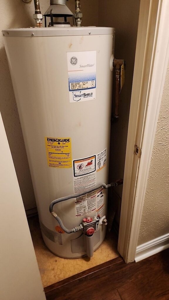 A water heater in a closet.