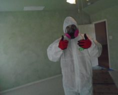 Technician giving thumbs up in his PPE.