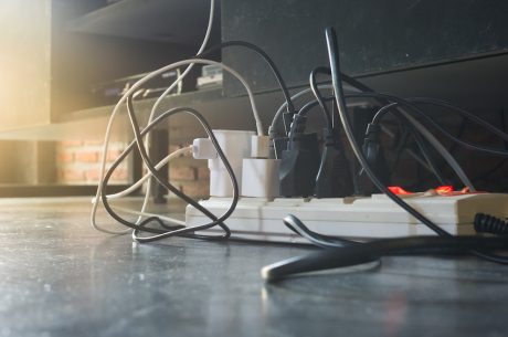 Power strip with multiple plugs in it.
