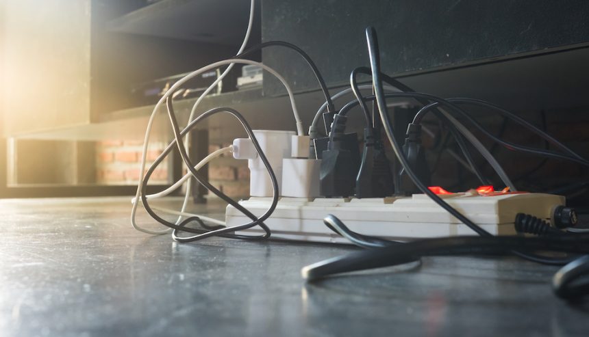 Power strip with multiple plugs in it.