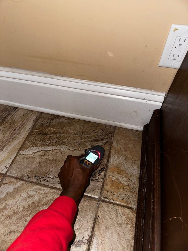 A moisture meter used on tile floor.