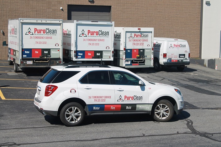 Puroclean vehicles parked outside to show scale of operation