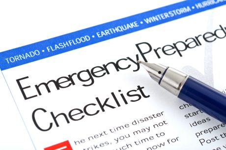 A page sporting an emergency preparedness checklist with a pen next to it