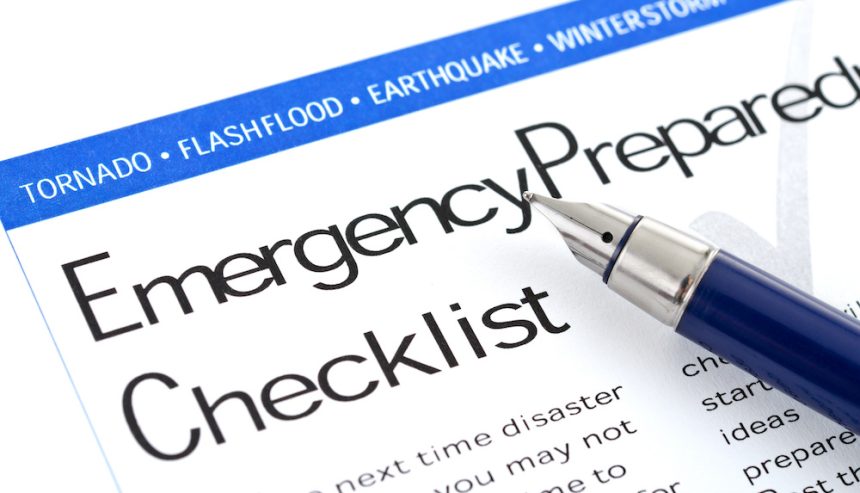 A page sporting an emergency preparedness checklist with a pen next to it