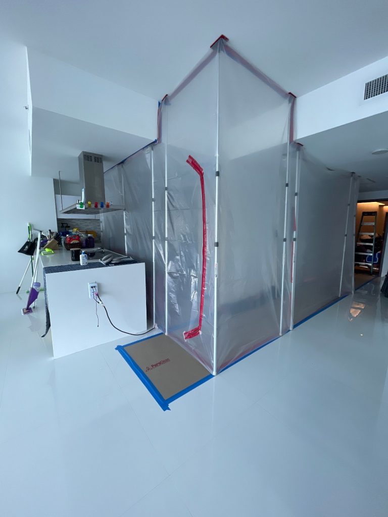 Hidden mold being contained and dried.