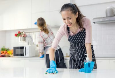 woman cleaning the kitchen