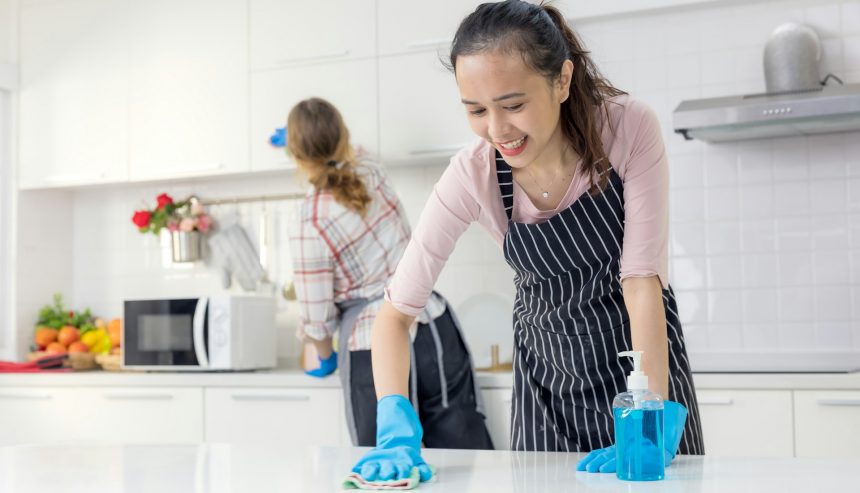 woman cleaning the kitchen