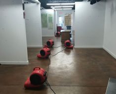 fans set up to dry water damage project