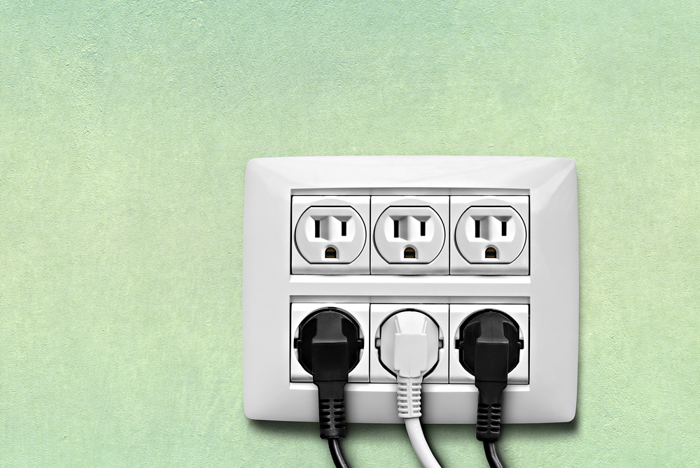 green wall with electric sockets