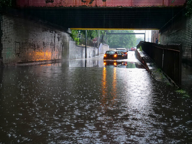 Flash flood in the middle of a road.