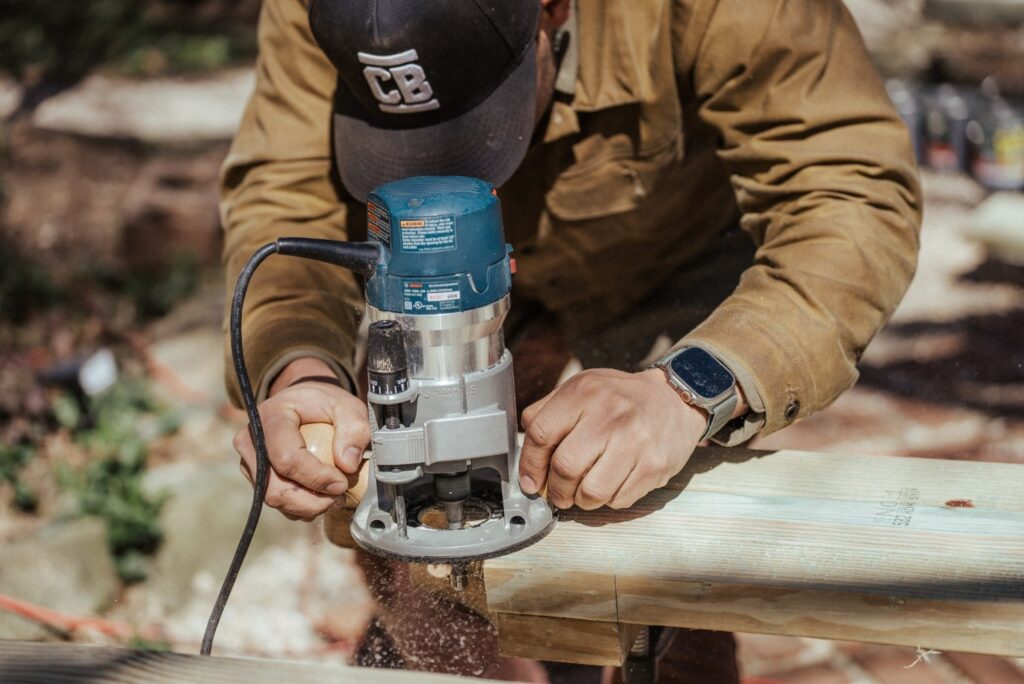 A man doing wood routing