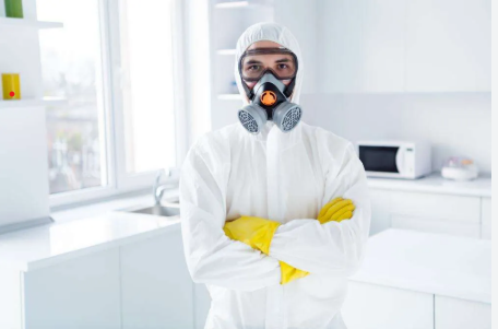 biohazard FAQs answered by certified cleanup technician in hazmat suit