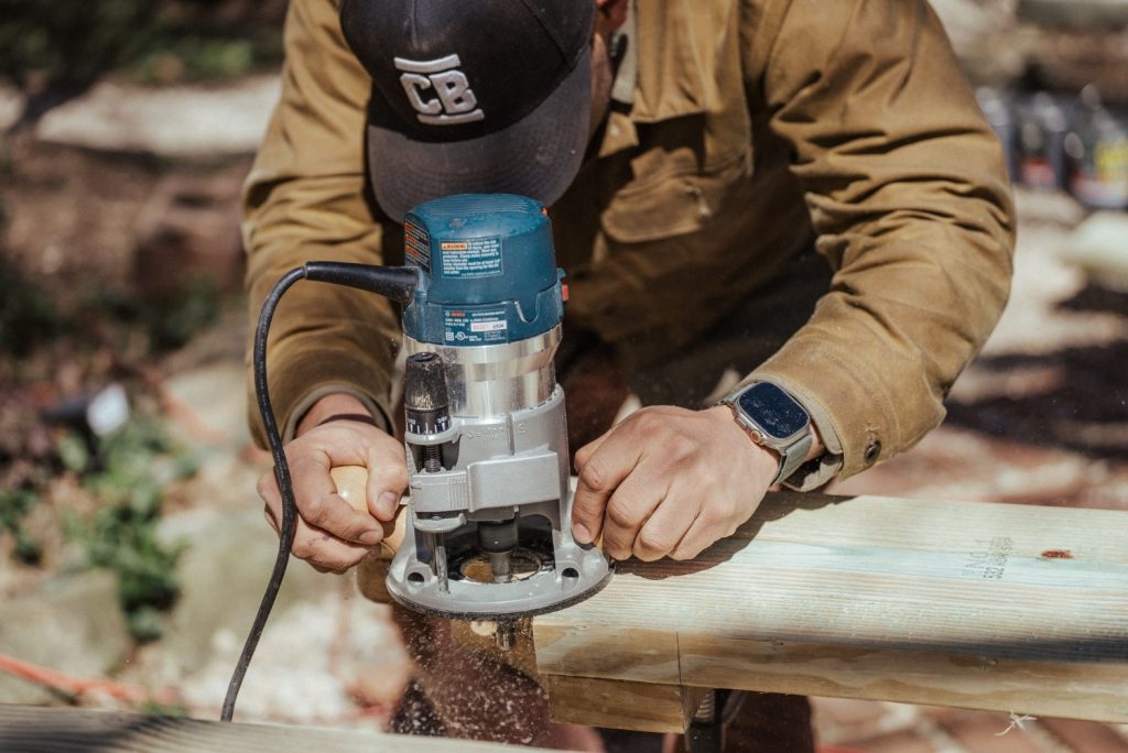 A man doing wood routing