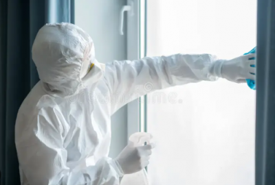 Professional crime scene cleanup Bradenton technician in protective gear working in residential property