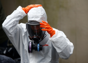 Certified trauma cleanup services Bradenton technician in full PPE removing biohazardous materials