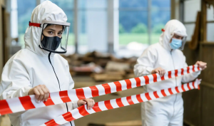 Professional blood cleanup services Bradenton FL technician in full protective gear