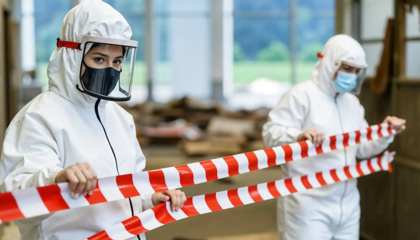 Professional blood cleanup services Bradenton FL technician in full protective gear