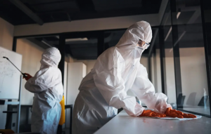 Professional blood cleanup services Bradenton FL technician in full protective gear