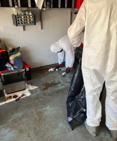 certified after death cleaning service technicians in protective gear at a Bradenton home