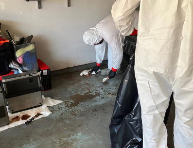 certified after death cleaning service technicians in protective gear at a Bradenton home