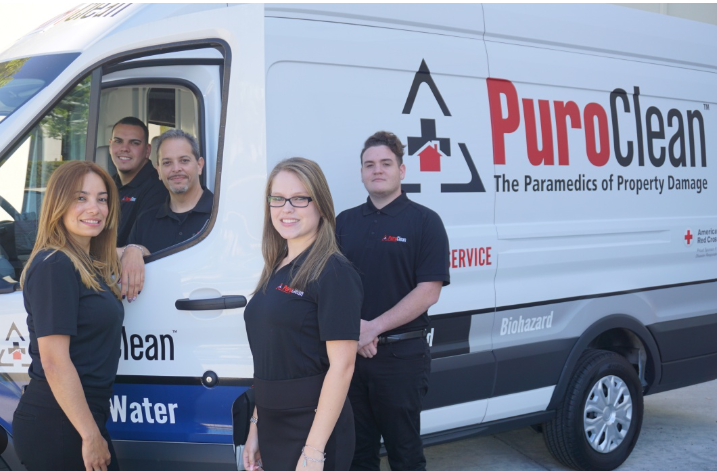 PuroClean of Bradenton technician discussing sewage contamination cleanup with homeowner