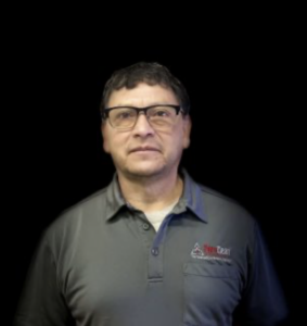 Man in glasses wearing a grey Fire Team polo