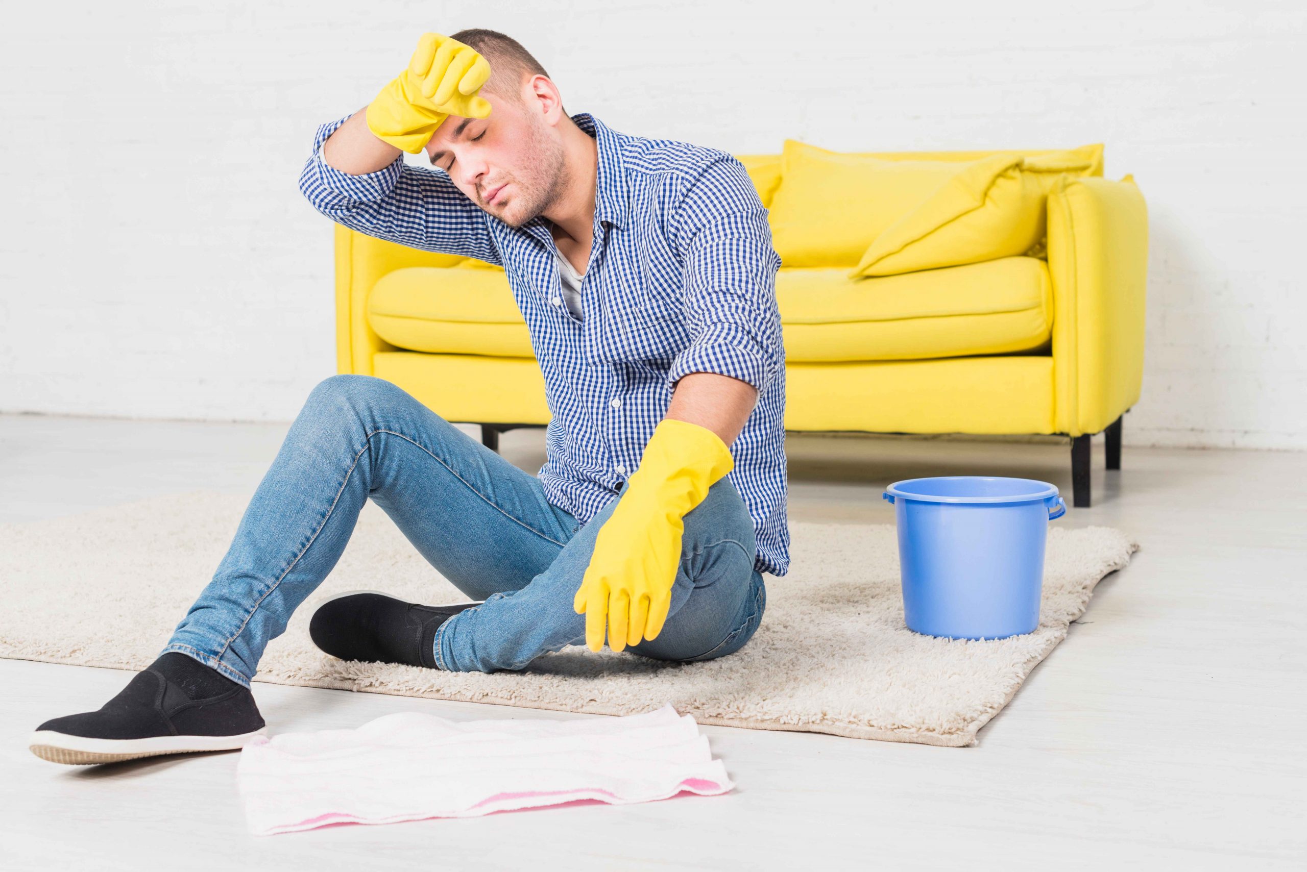 man-is-tired-from-cleaning due to water damage