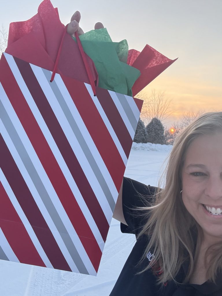 PuroClean Burlington team member delivering Christmas treats after house fire East Troy