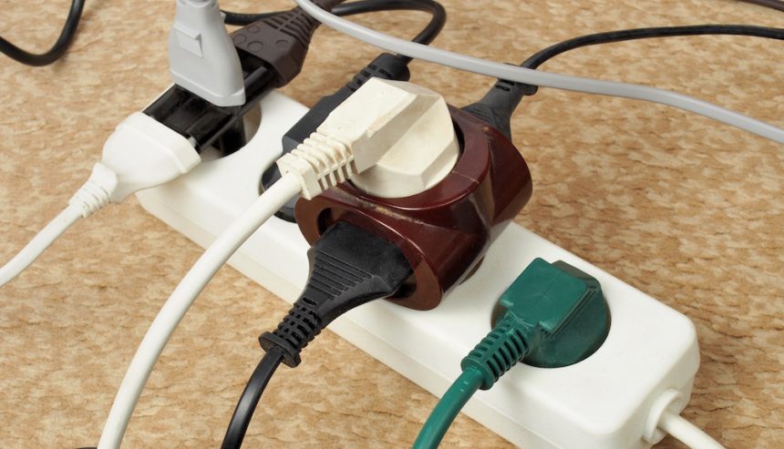 White power cord with multiple plugs in it