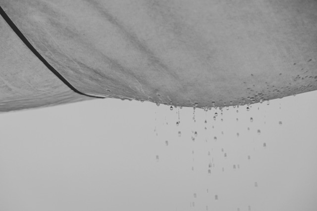 Leaking roof covering with visible dripping water