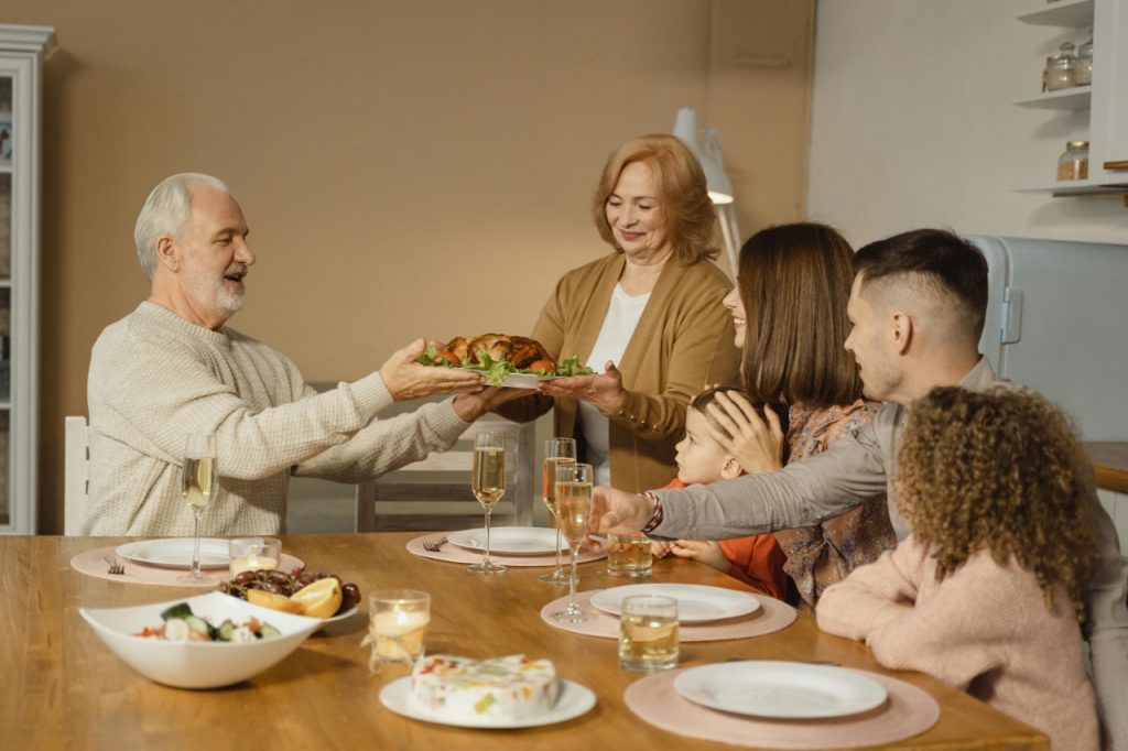 Family enjoying Thanksgiving dinner safely in Atlanta home