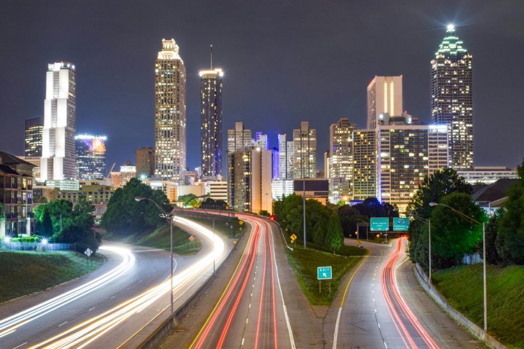 Atlanta Georgia skyline at night representing PuroClean North Metro Atlanta service area for moisture mapping and water damage restoration in Canton, Roswell, Alpharetta, Woodstock, and Johns Creek