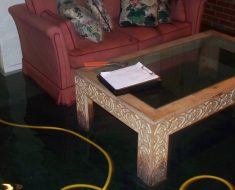 Flooded living room before water damage remediation by PuroClean Disaster First Response Fayetteville NC