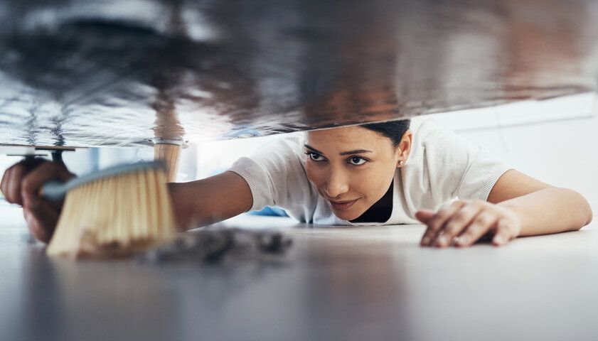 When doing regular cleanings, don't forgo cleaning under furniture, carpets, or vents. Dust buildup in these hard-to-reach areas is common.