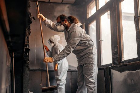 Restoration professionals cleaning smoke and soot during fire damage restoration in Apex NC to repair and restore residential property
