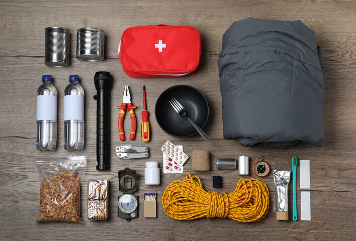 Emergency preparedness kit laid out on table.