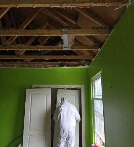 Structural demolition and cleanup were performed safely using containment barriers and protective equipment.