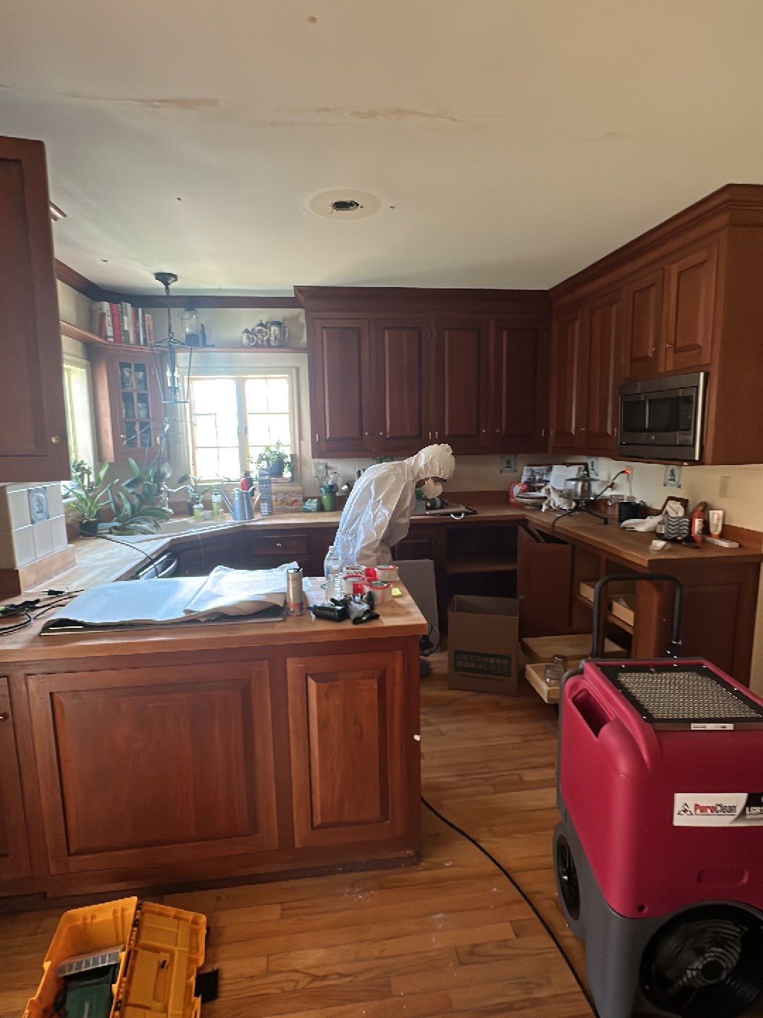 Employees in protective gear setting up