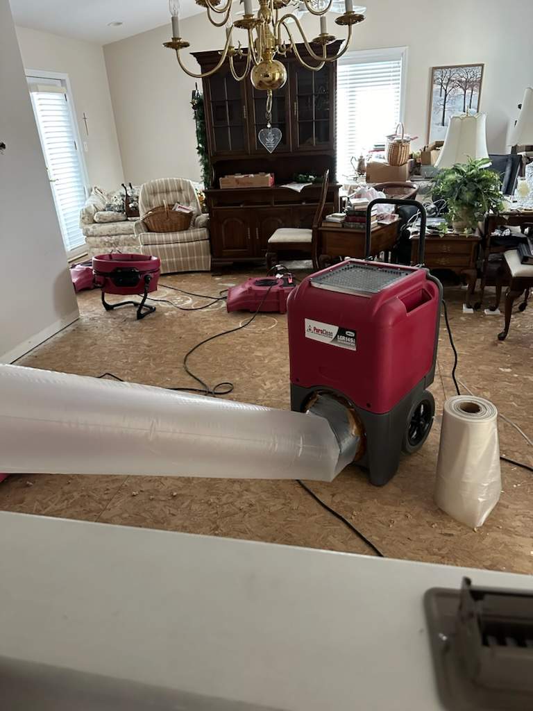 Professional dehumidifiers and fan equipment in a customers home to aid the drying process.