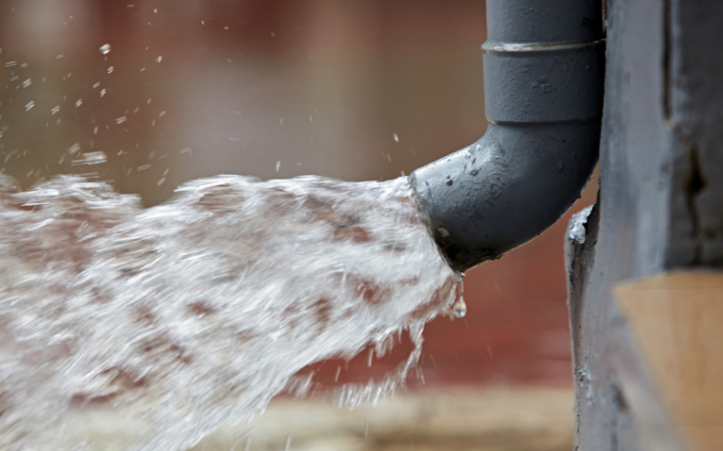 water pouring through a drain - sump pump