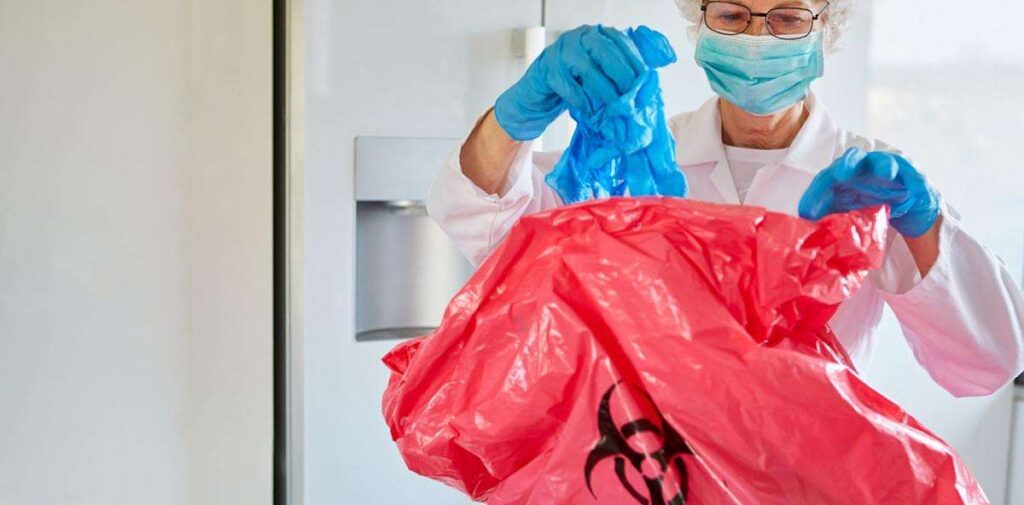 professional biohazard cleanup technicians wearing protective suits inside residential property