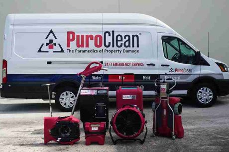 Restoration team arriving at a property with emergency equipment