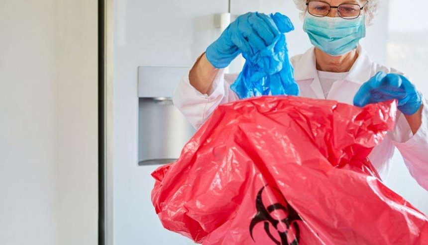 professional biohazard cleanup technicians wearing protective suits inside residential property