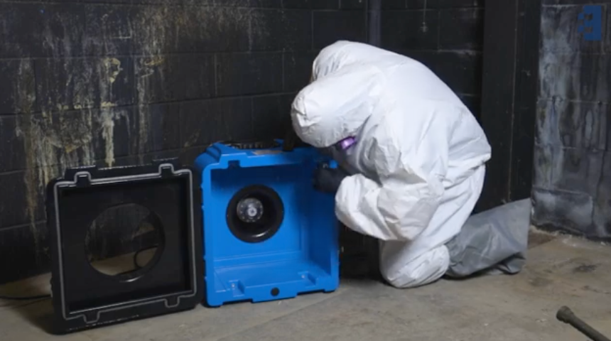 HEPA air scrubber running in a fire damaged room