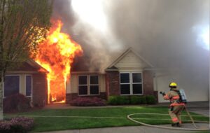 Exterior view of a severe house fire requiring critical fire damage restoration in Charleston