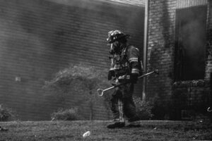 A professional assessing property needs for fire damage restoration in Charleston