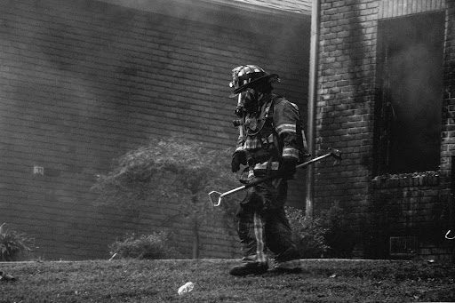 A professional assessing property needs for fire damage restoration in Charleston