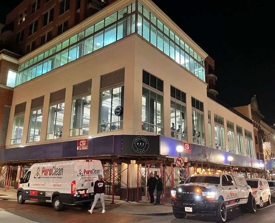 PuroClean vans located outside building where commercial water loss restoration work was being completed.